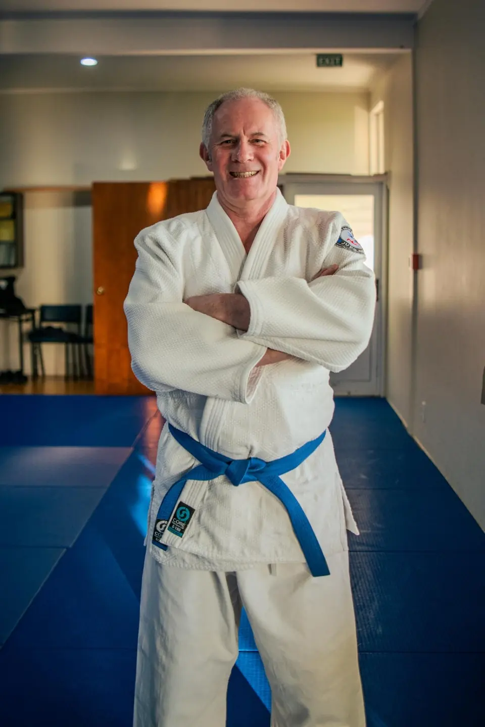 Coach Robert Stillion wearing his blue belt at Blenheim Judo Club
